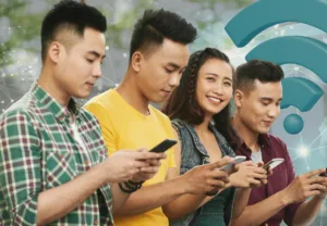 Young Filipinos using smartphones with a digital network overlay and Wi-Fi symbol, representing expanding internet access and connectivity in the Philippines