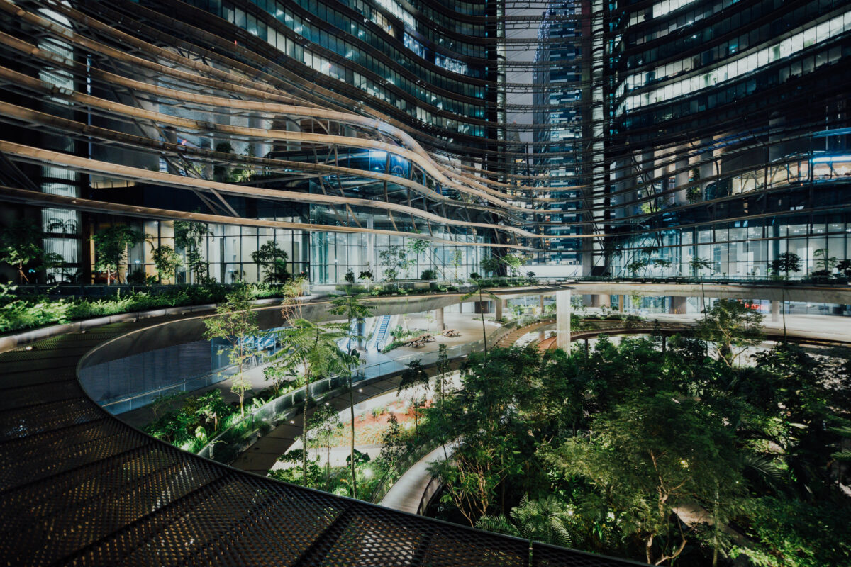 Futuristic sustainable building with integrated greenery representing innovation in sustainability
