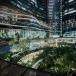 Futuristic sustainable building with integrated greenery representing innovation in sustainability