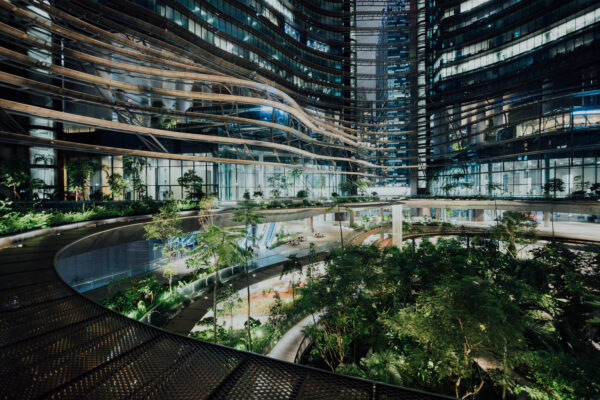 Futuristic sustainable building with integrated greenery representing innovation in sustainability