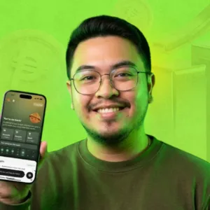 Theo Roque, Founder of Savio, holding the Savio app interface
