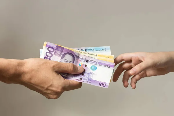 depositphotos 321852570 stock photo hand holding giving cash banknotes